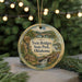 A circular ornament with a scenic image of Twin Bridges State Park in Oklahoma, featuring a bridge, a waterfall, and a bird in flight.
