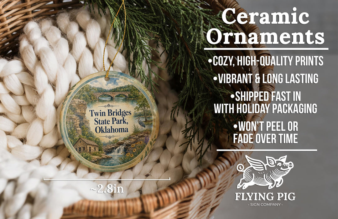 Ceramic ornaments, featuring a design of a scenic landscape with a waterfall, are displayed in a woven basket.