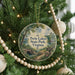 A round ornament hanging on a Christmas tree, featuring a scenic image of Twin Lakes State Park, Virginia.