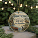 A round ornament featuring a moose, canoe, and loon in a scenic landscape, with the text "Umbagog Lake State Park, New Hampshire" displayed prominently.