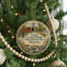 A round ornament hanging on a Christmas tree, featuring a painting of a covered bridge and the text "Union Covered Bridge State Historic Site, Missouri".