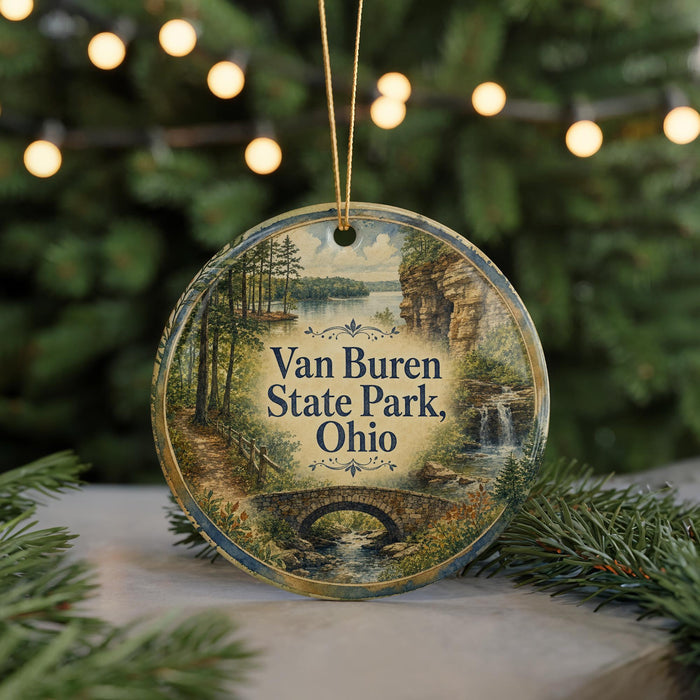 A round ornament with a scenic image of Van Buren State Park, Ohio, hanging from a string.