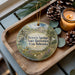 A wooden tray with a decorative ornament featuring a scenic landscape of Victoria Springs State Recreation Area, Nebraska, and pine cones.