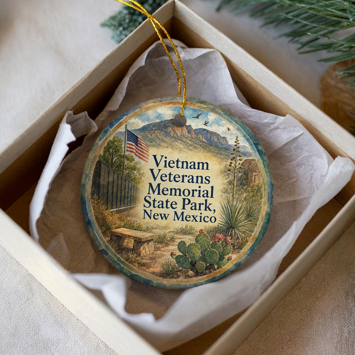 A decorative ornament in a white box, featuring an illustration of Vietnam Veterans Memorial State Park in New Mexico.