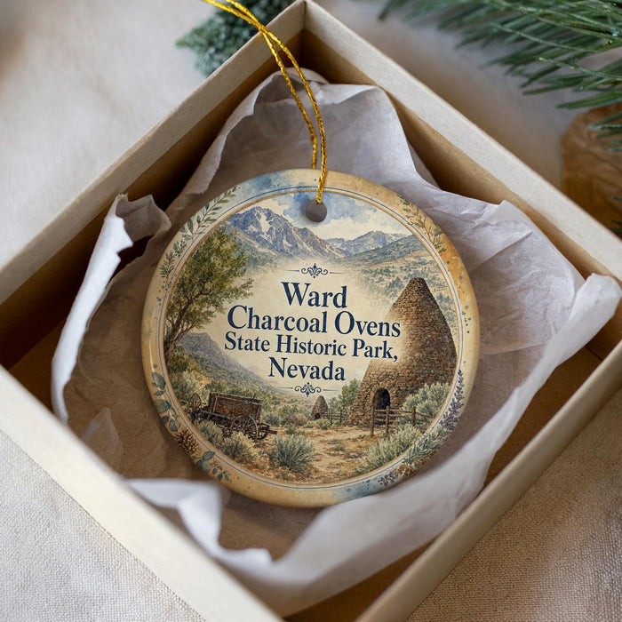 A decorative ornament in a box, featuring a scenic illustration of a historic park in Nevada.