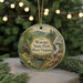 A round ornament with a scenic landscape of Watoga State Park, West Virginia, featuring a waterfall, a cabin, and pine trees.