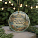 A round ornament with a scenic landscape of mountains, trees, and a lake, featuring the text "Wayfarers State Park, Montana" on it.