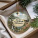 A decorative ornament with a scenic landscape of Weeks State Park in New Hampshire, featuring a waterfall and pine trees.