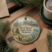 A decorative ornament featuring a scenic landscape of West Shore State Park, Montana, with a lake, mountains, and pine trees.