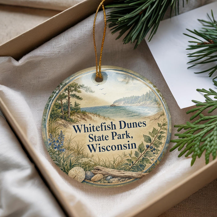 A decorative ornament with a scenic landscape of Whitefish Dunes State Park, Wisconsin, hanging from a string.