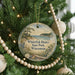 A round ornament on a Christmas tree, featuring a scenic landscape of Whitefish Dunes State Park, Wisconsin.