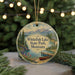 A round ornament with a scenic image of Whitewater Lake State Park, Montana, featuring a lake, mountains, pine trees, and a red canoe.