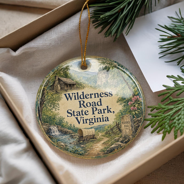 A round ornament with a scenic illustration of Wilderness Road State Park, Virginia, hanging from a string.