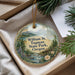 A decorative ornament with a scenic landscape of William M. Tugman State Park, Oregon, displayed in a box with pine branches.