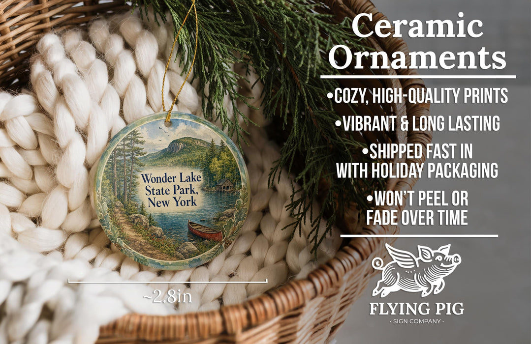 Ceramic ornaments, featuring a vintage-style design of a lake and mountains, are displayed in a woven basket.