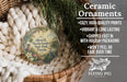 Ceramic ornaments, featuring a round ornament with a garden scene and text, hanging in a basket with greenery.