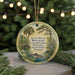 A round ornament with a painting of a pond and trees, featuring text that reads "Allen David Broussard, Catfish Creek, Preserve, State Park, Florida".