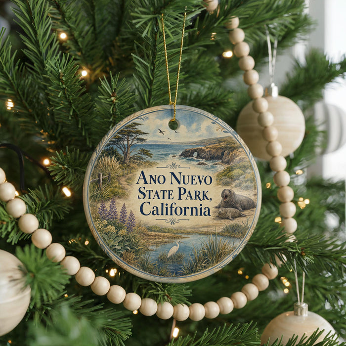 A round ornament hanging on a Christmas tree, featuring an illustration of a scenic landscape with a body of water, trees, and wildlife.
