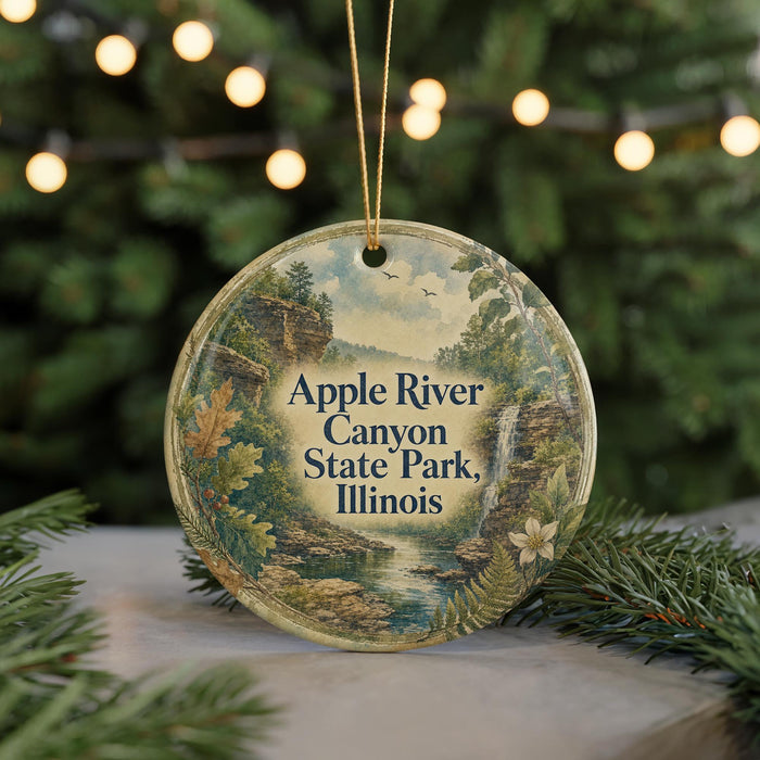 A circular ornament with a scenic image of the Apple River Canyon State Park in Illinois, surrounded by greenery and a string of lights.