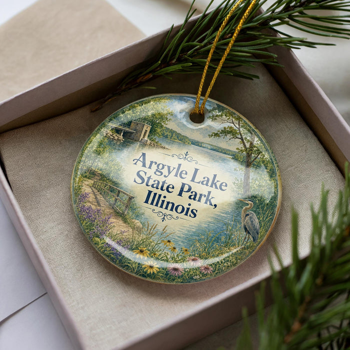 A decorative ornament with a scenic image of Argyle Lake State Park, Illinois, featuring a bird, a bridge, and a body of water.