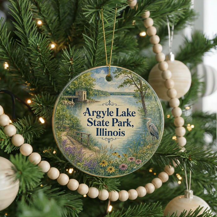A circular ornament hanging on a Christmas tree, featuring a scenic view of Argyle Lake State Park, Illinois.