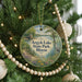 A circular ornament hanging on a Christmas tree, featuring a scenic view of Argyle Lake State Park, Illinois.