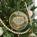 A round ornament on a Christmas tree, featuring a scenic image of the desert landscape of Arthur B. Ripley Desert Woodland State Park, California.