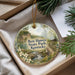 A decorative ornament with a scenic landscape of Ben Hawes State Park, Kentucky, featuring a waterfall and a wooden bridge.