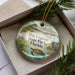 A decorative ornament in a box, featuring an illustration of Big Lagoon State Park, Florida, with a bird and a turtle in the foreground.