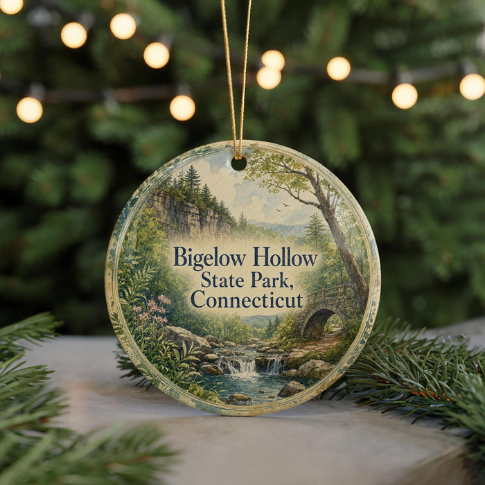 A round ornament with a scenic landscape of a forest and a waterfall, featuring the text "Bigelow Hollow State Park, Connecticut".