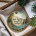 A decorative ornament with a scenic image of Blue Springs State Park, Alabama, hanging from a string.