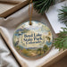 A decorative ornament with a scenic landscape of Boyd Lake State Park, Colorado, featuring a bird, a fish, and a boat.