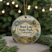A round ornament with a scenic landscape of Boyd Lake State Park, Colorado, featuring a boat, a bird, and a fish.