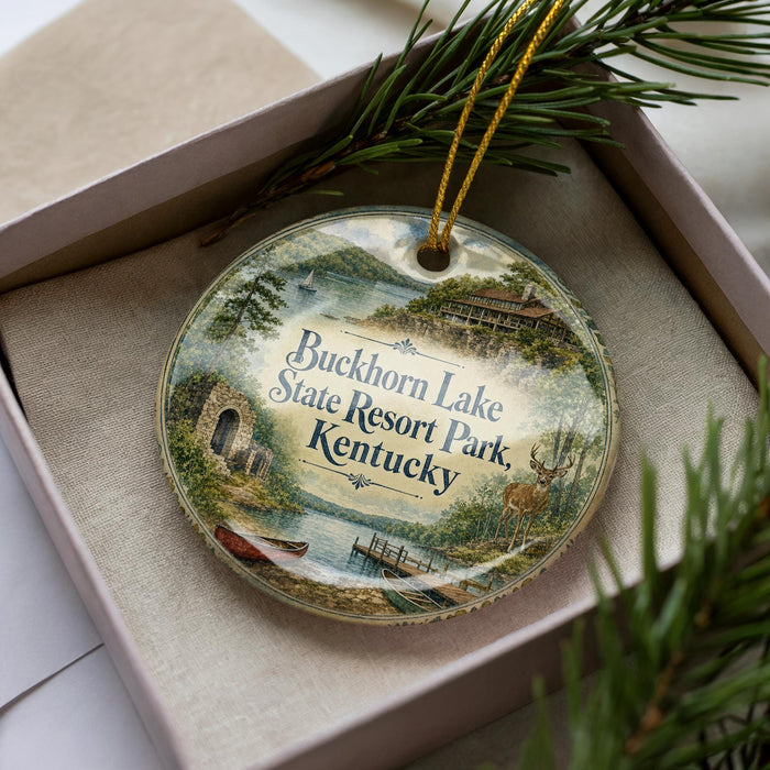A decorative ornament in a box, featuring a scenic image of Buckhorn Lake State Resort Park, Kentucky.