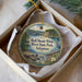 A decorative ornament in a white box, featuring a scenic image of the Bull Shoals-White River State Park in Arkansas.