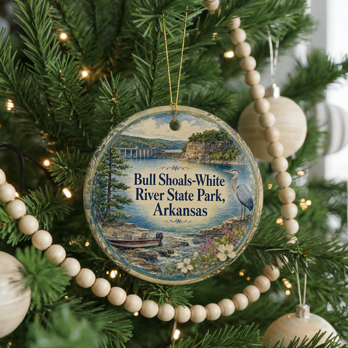 A circular ornament hanging on a Christmas tree, featuring a scenic image of the Bull Shoals-White River State Park in Arkansas.