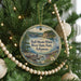 A circular ornament hanging on a Christmas tree, featuring a scenic image of the Bull Shoals-White River State Park in Arkansas.