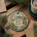 A circular ornament with a painting of a bird and palm trees, surrounded by text that reads "Bulow Plantation Ruins Historic State Park, Florida".