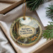 A decorative ornament with a scenic image of Butano State Park, California, hanging from a string.
