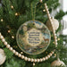 A Christmas tree ornament with a scenic image of a deer in a field, surrounded by trees and a bridge, with the text "Cambridge Junction Historic State Park, Michigan" displayed on it.