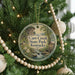 A round ornament on a Christmas tree, featuring a scenic image of Carr Creek State Park in Kentucky.
