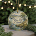 A round ornament with a scenic landscape of Cherry Creek State Park, Colorado, featuring a bird, a boat, and a mountain backdrop.