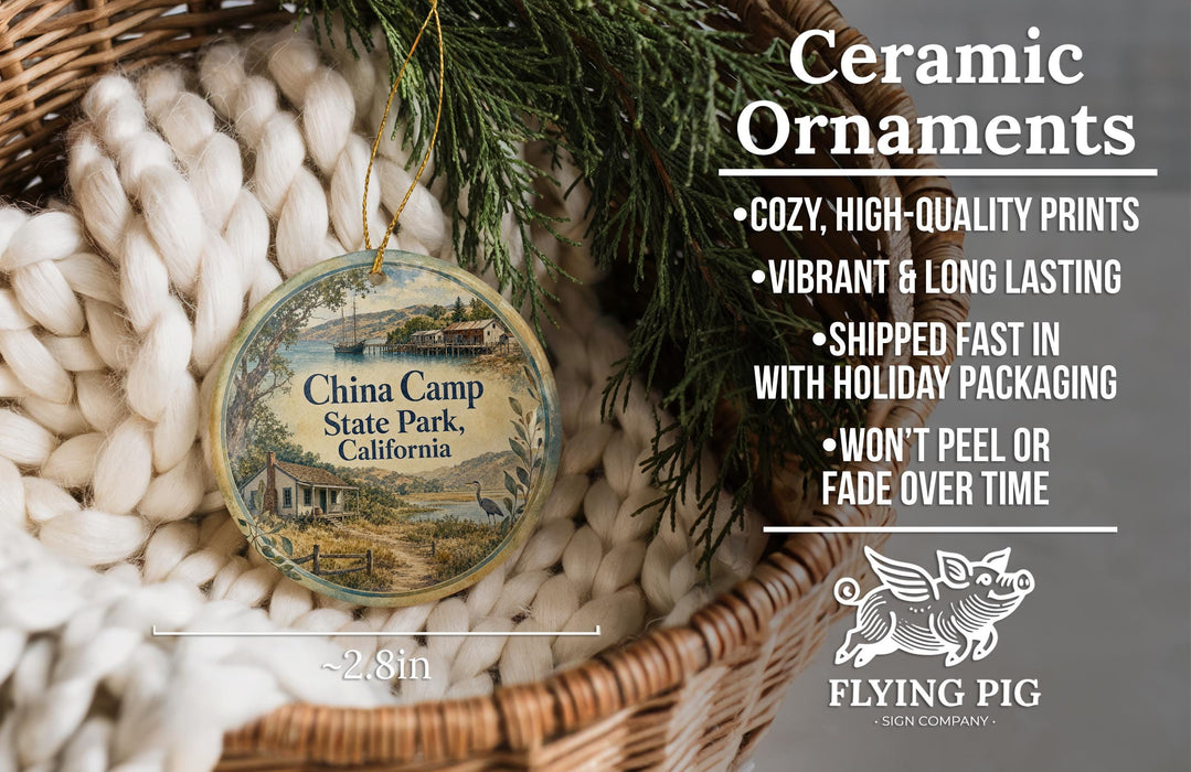 Ceramic ornaments, featuring a round ornament with a scenic image of China Camp State Park, California, hanging from a wicker basket.