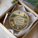 A decorative ornament in a box, featuring a scenic image of Crater of Diamonds State Park in Arkansas.