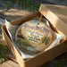 A decorative ornament in a wooden box, featuring a scenic image of Dead Horse Ranch State Park, Arizona.
