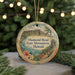 A round ornament with a scenic image of the Diamond Head State Monument in Hawaii, surrounded by greenery and twinkling lights.