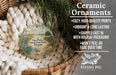 Ceramic ornaments, featuring a bird and palm tree design, are displayed in a wicker basket.