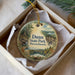A circular ornament with a scenic landscape of a forest and a lake, featuring the text "Dunn State Park, Massachusetts" on it.
