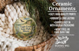 Ceramic ornaments, featuring a bird and a landscape, are displayed in a basket with greenery.