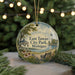 A round ornament with a scenic view of East Tawas City Park, Michigan, featuring a gazebo, bench, and flowers.